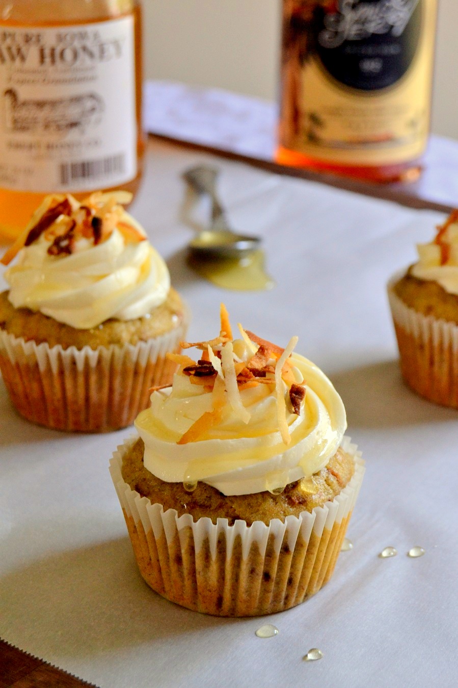 Toasted Coconut Banana Cupcakes with Rum Spiked Honey Swirl Frosting